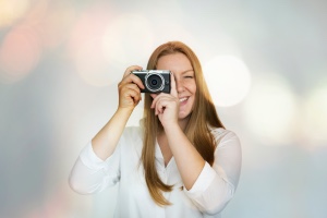 female photographer with film camera