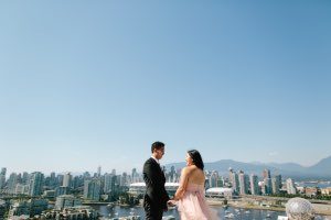 bride and groom overlooking the city