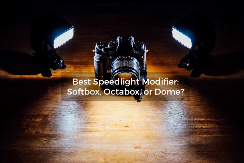 camera on wooden table with speedlight flash