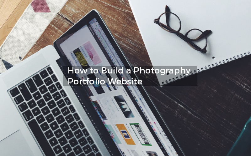 macbook on desk with notepad