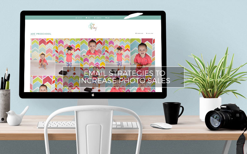 Computer showing email with a camera on the desk