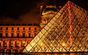 The Louvre art gallery exterior at night