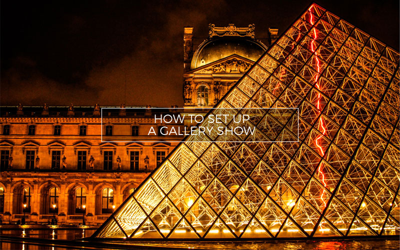 The Louvre art gallery exterior at night