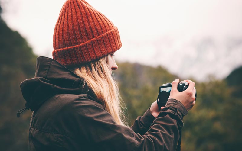 woman outdoors with landscape camera