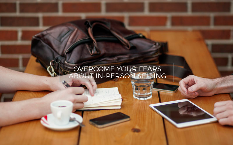 Photographer selling photos in a coffee shop