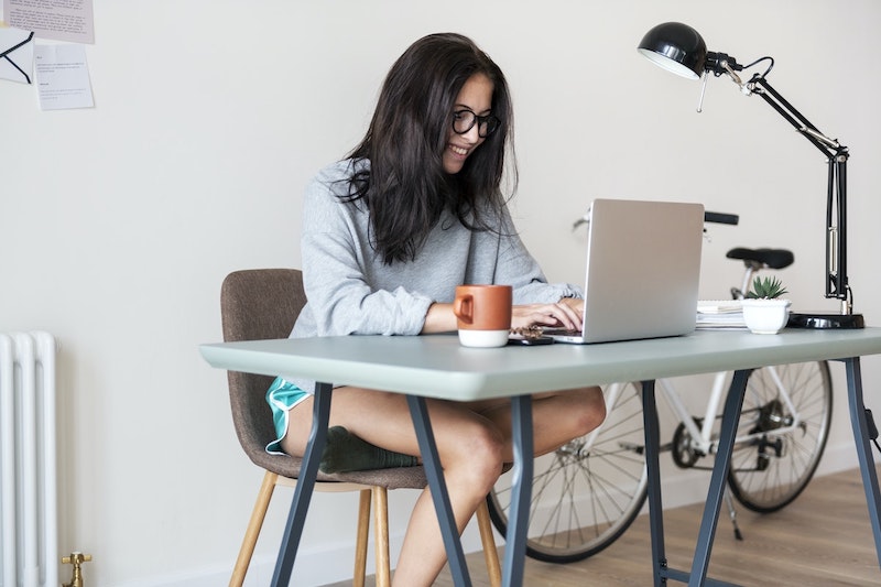 woman at desk in apartment