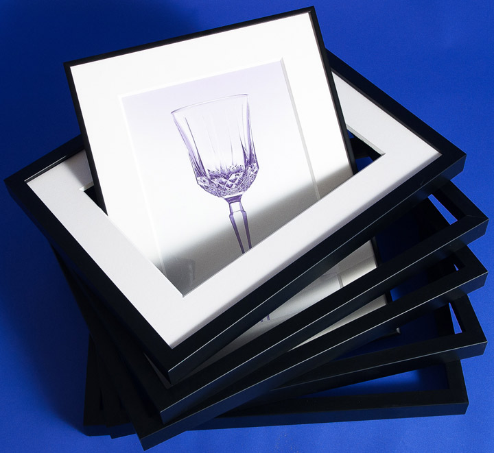 stack of similarly sized black frames