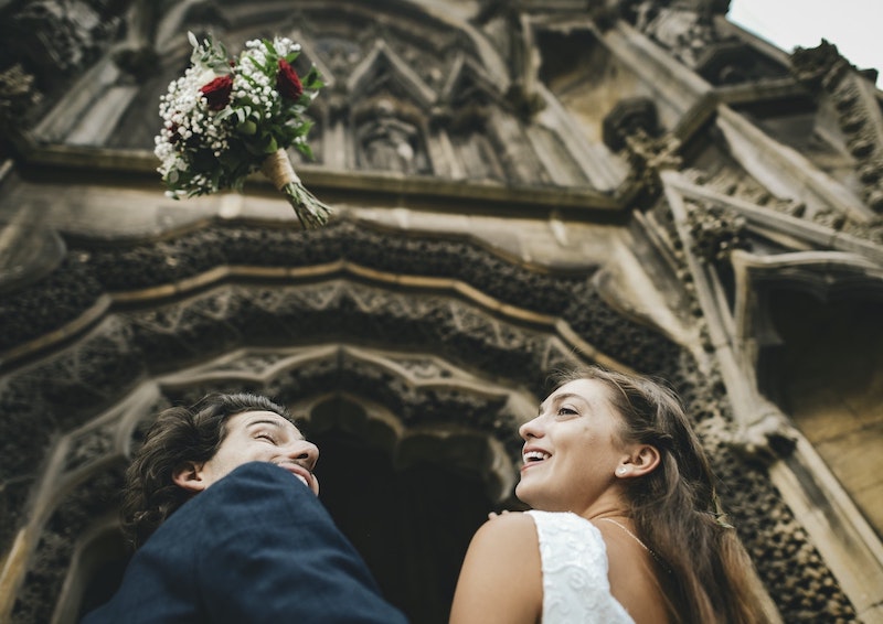 bride and groom in front of church