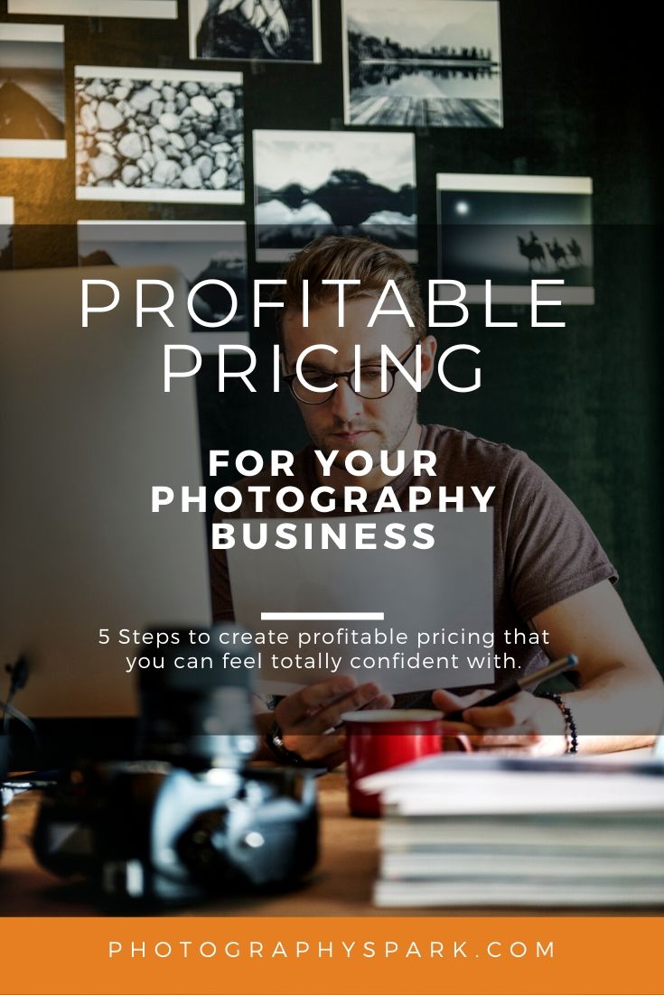 man at computer of photography business