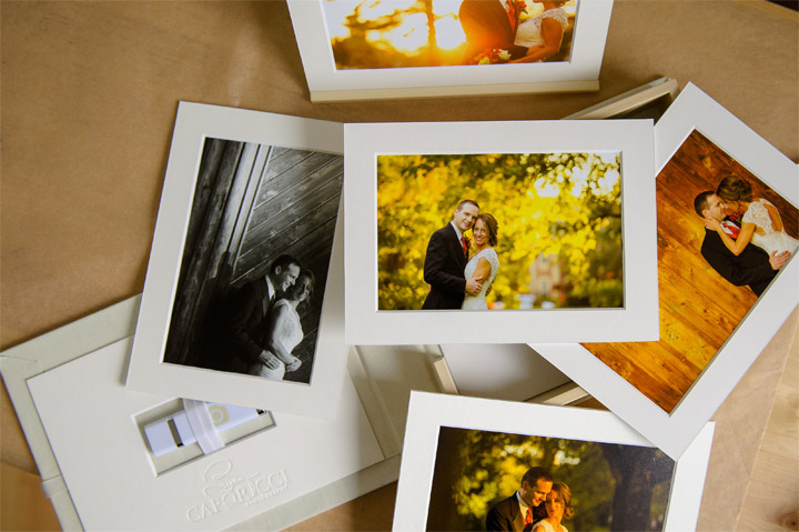 Printed photos lined up on a table
