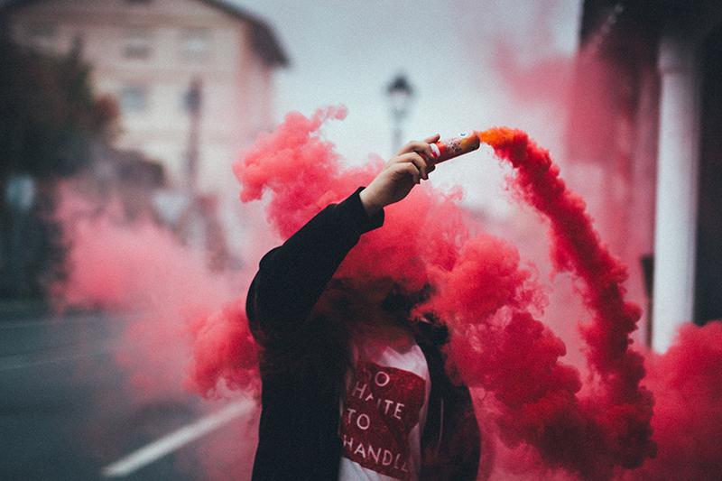 photoshoot of person with colorful smoke