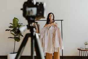 female filming YouTube vlog